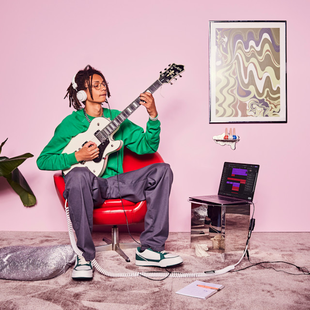 Man recording guitar on a mobile studio setup