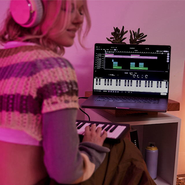 Woman playing MIDI piano