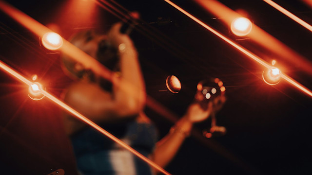 Girl singing holding a wine glass