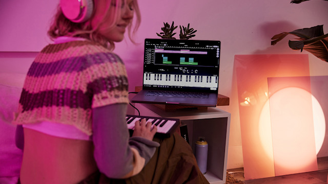 Woman playing MIDI keyboard in Soundtrap