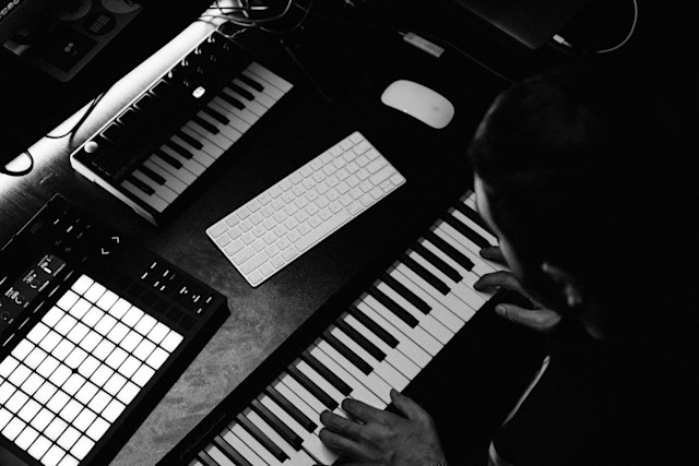 Man playing a MIDI keyboard