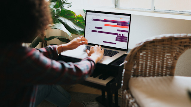 A girl producing music using loops in Soundtrap