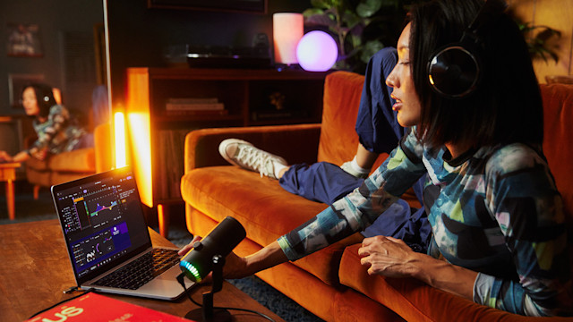 Girl mixing music on a laptop