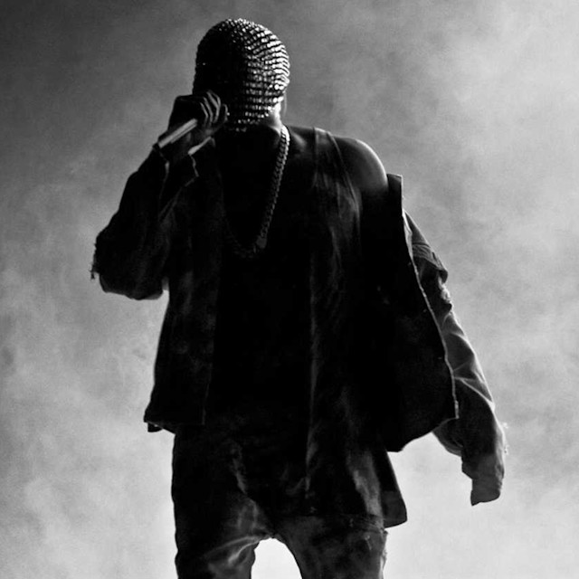 A drill musician in a mask on stage