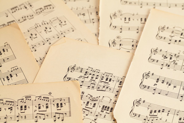 A pile of pages of sheet music