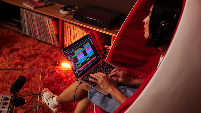 Girl on chair making music on Soundtrap