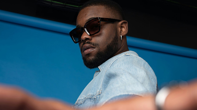 An Afrobeat artist looking at the camera