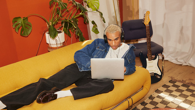 Man creating music on his laptop