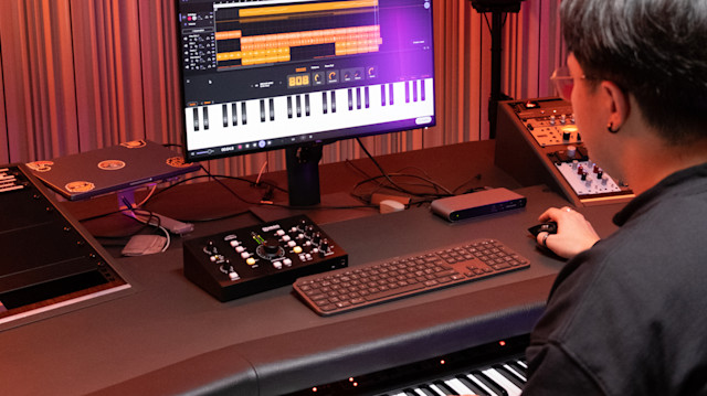 A person using Soundtrap's 808 with glide instrument.
