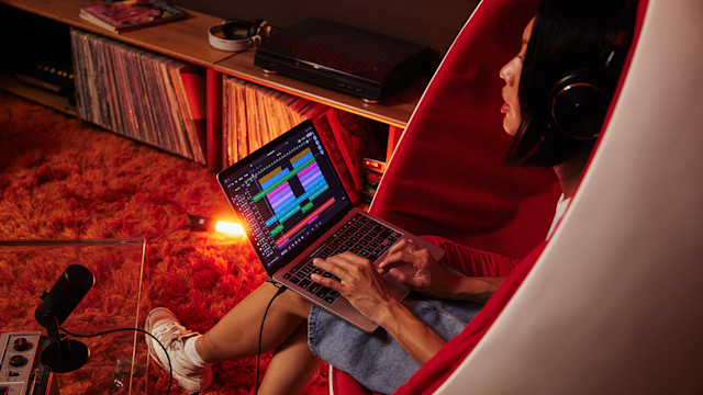 Girl making music from a laptop