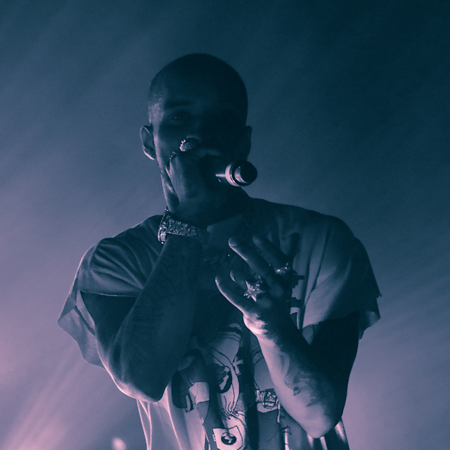 Rapper on stage rapping into a mic