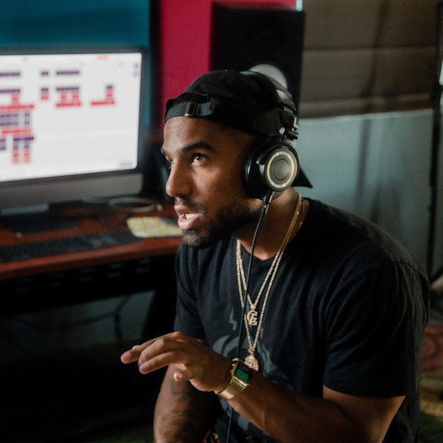 Studio engineer explaining song parts to students