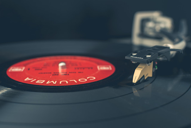 An image of a vinyl record player spinning a record