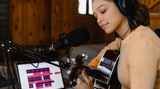 A female songwriter recording a demo project in Soundtrap