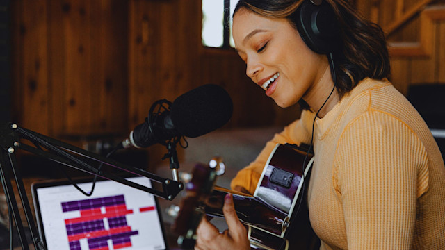 Woman recording a song