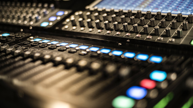 An image of a mixing and mastering console in a studio