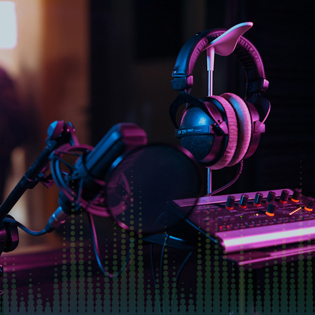 A studio setup showing a mic and volume controller