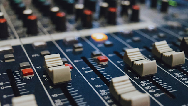 Audio mixer faders and knobs